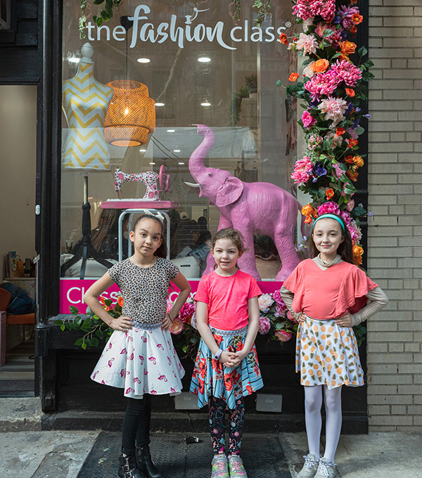 Kids standing in front of The Fashion Class Storefront