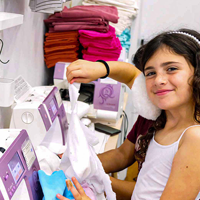 Girl at Sewing Machine